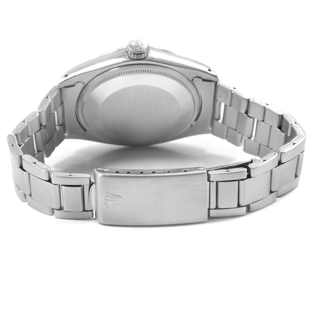 This image shows the back view of a Rolex Date 1500 Men's Stainless Steel Silver Dial 1500 Men's Stainless Steel Silver Dial model watch, highlighting the bracelet, clasp, and case back.