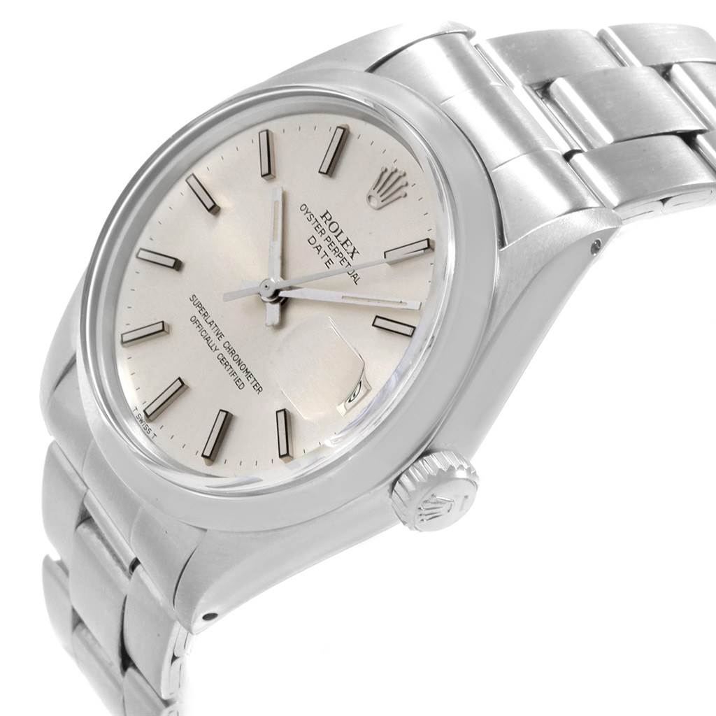 The image shows a side and top view of a Rolex Date 1500 Men's Stainless Steel Silver Dial 1500 Men's Stainless Steel Silver Dial model watch, highlighting its face, case, crown, and part of the bracelet.