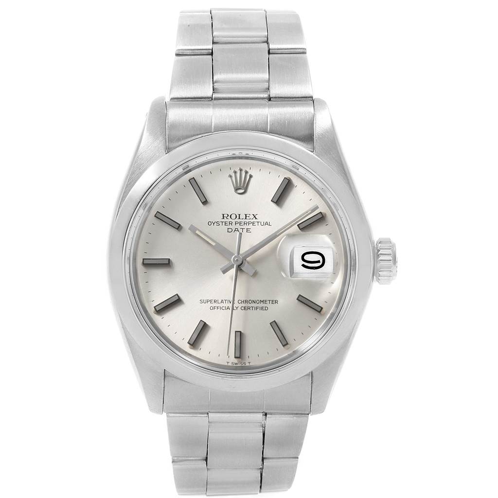 The image shows a front view of a Rolex Oyster Perpetual Date watch, highlighting the dial, bezel, bracelet, and date window.