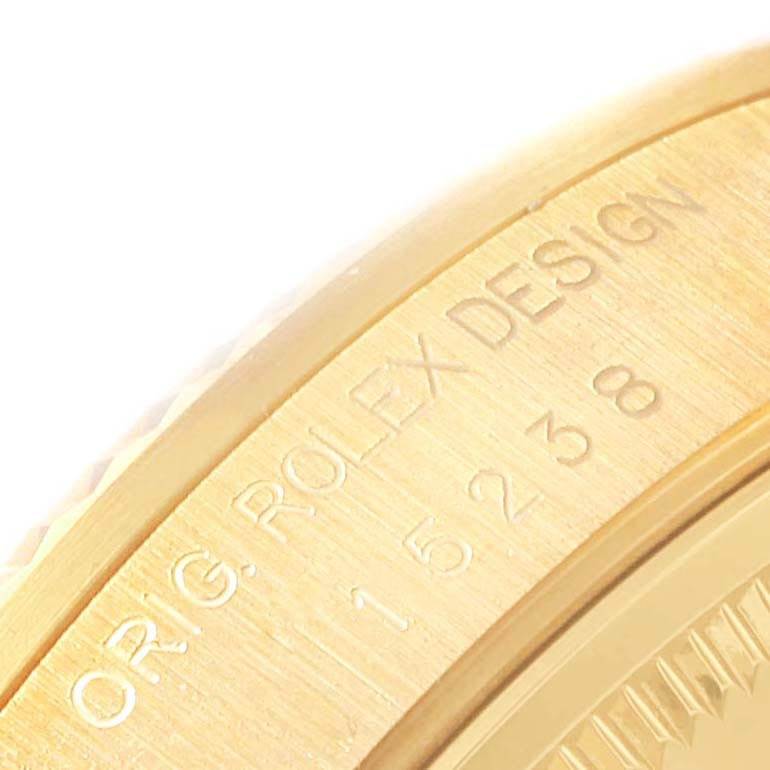 The image shows a close-up of the side of a Rolex Date 15238 Men's Yellow Gold Champagne Dial 15238 Men's Yellow Gold Champagne Dial model, highlighting the "ORIG. ROLEX DESIGN" inscription and part of the serial number.