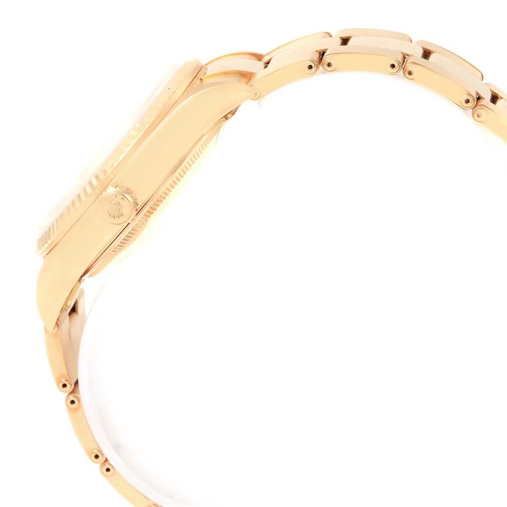 This image displays a side view of a Rolex Date 15238 Men's Yellow Gold Champagne Dial 15238 Men's Yellow Gold Champagne Dial model watch, showcasing the watch case, crown, and part of the bracelet.