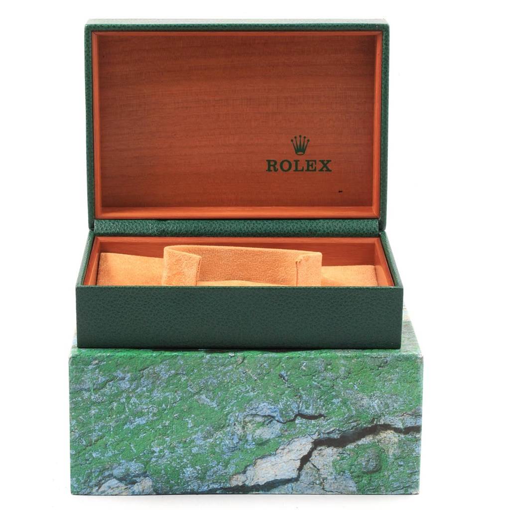 The image shows an open Rolex Date 15238 Men's Yellow Gold Champagne Dial 15238 Men's Yellow Gold Champagne Dial watch box from a front-facing angle, featuring green and brown colors with a cushioned section inside.