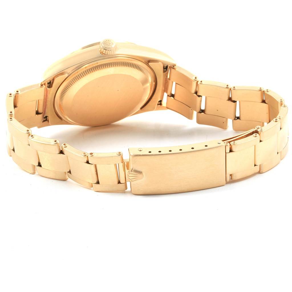 The image shows the back view of a Rolex Date 15238 Men's Yellow Gold Champagne Dial 15238 Men's Yellow Gold Champagne Dial model watch, highlighting the case back and bracelet.