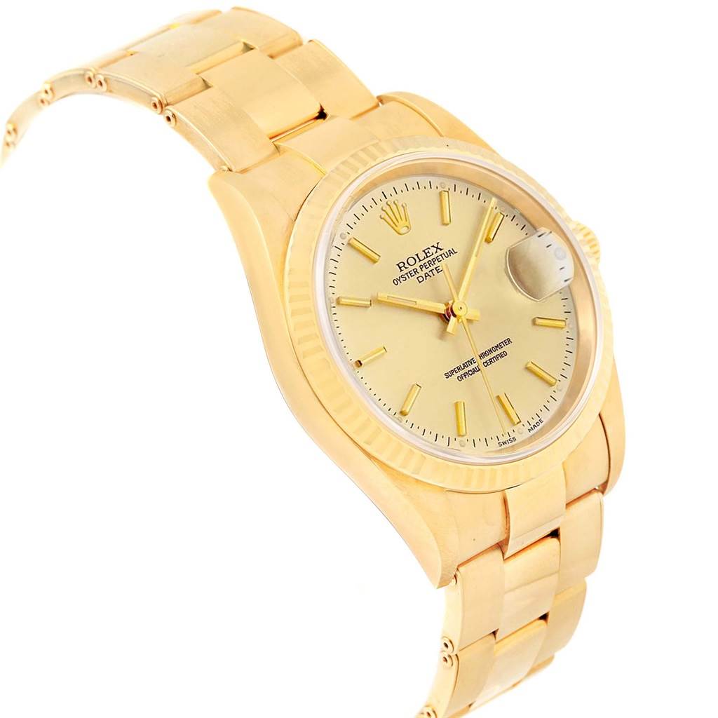 This image shows a side-angle view of a gold Date model by Rolex, displaying its face, bezel, and bracelet.