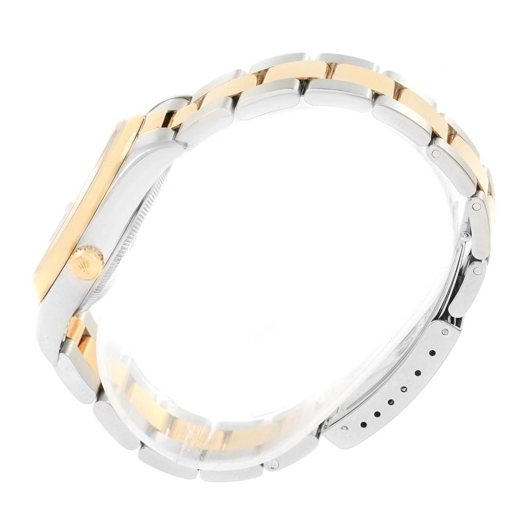 This image shows a side view of a Rolex Date 15203 Men's Steel and Gold (two tone) Blue Dial 15203 Men's Steel and Gold (two tone) Blue Dial model watch, highlighting the case, crown, and the two-tone bracelet.