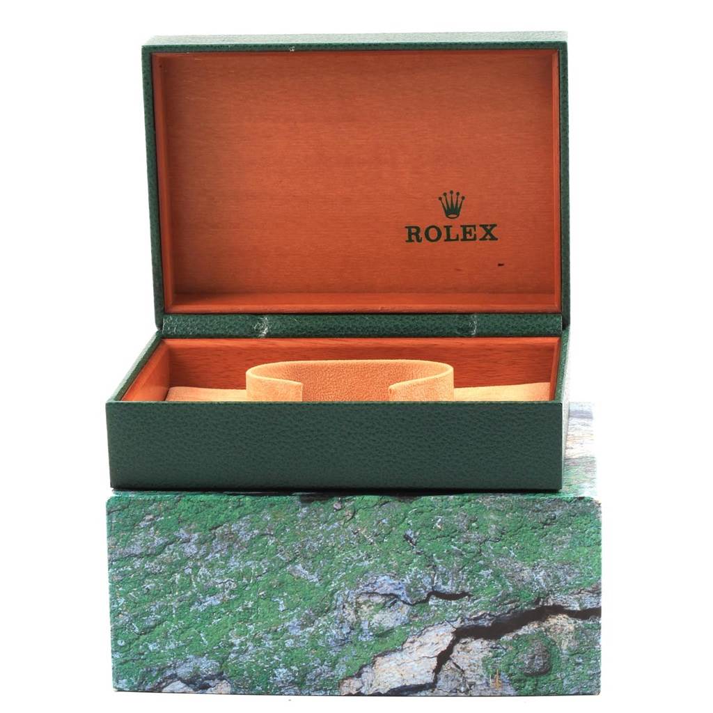 The image shows an empty green and wood Rolex Date 15203 Men's Steel and Gold (two tone) Blue Dial 15203 Men's Steel and Gold (two tone) Blue Dial model watch box, open from a front angle.