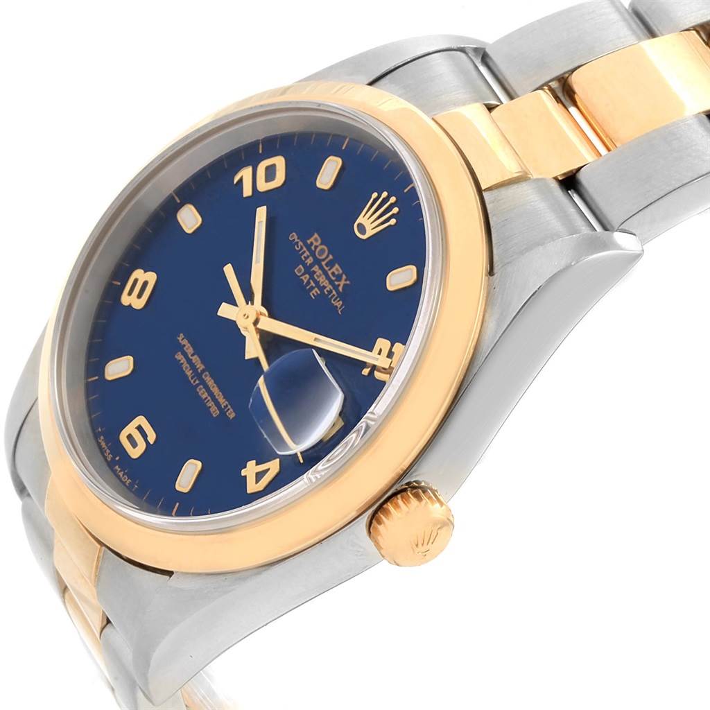 The Rolex Date 15203 Men's Steel and Gold (two tone) Blue Dial 15203 Men's Steel and Gold (two tone) Blue Dial model watch is shown at an angle highlighting its face, crown, and part of the bracelet.