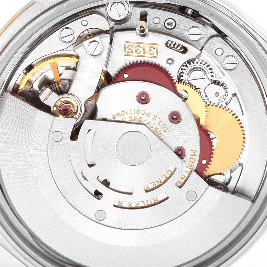 This is a close-up shot of the movement mechanism of a Rolex Date 15203 Men's Steel and Gold (two tone) Champagne Dial 15203 Men's Steel and Gold (two tone) Champagne Dial model watch, showing gears and internal components.