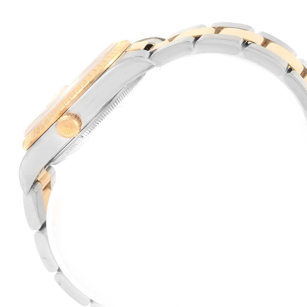 The image shows a side profile of a Rolex Date 15223 Men's Steel and Gold (two tone) Champagne Dial 15223 Men's Steel and Gold (two tone) Champagne Dial model, highlighting the case, crown, and part of the bracelet.