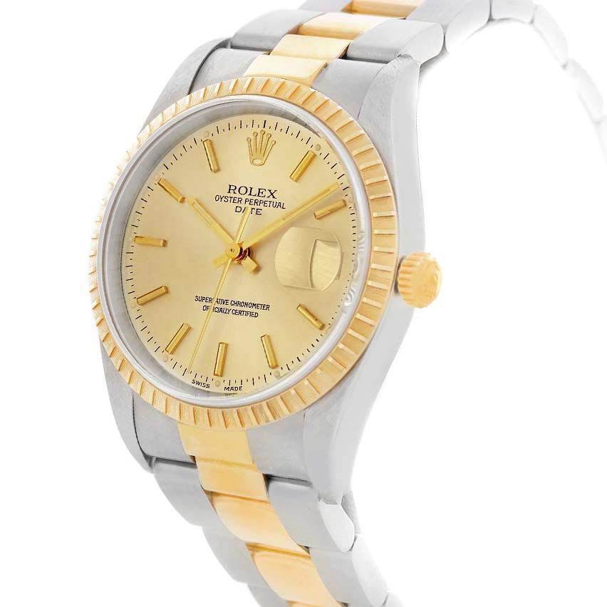 The image shows a Rolex Date 15223 Men's Steel and Gold (two tone) Champagne Dial 15223 Men's Steel and Gold (two tone) Champagne Dial watch angled from the left, highlighting the face, bezel, crown, and two-tone bracelet.