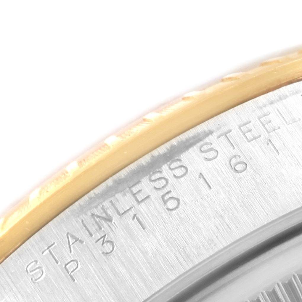 This close-up image shows the engraved stainless steel caseback edge of a Rolex Date 15223 Men's Steel and Gold (two tone) Champagne Dial 15223 Men's Steel and Gold (two tone) Champagne Dial model watch.