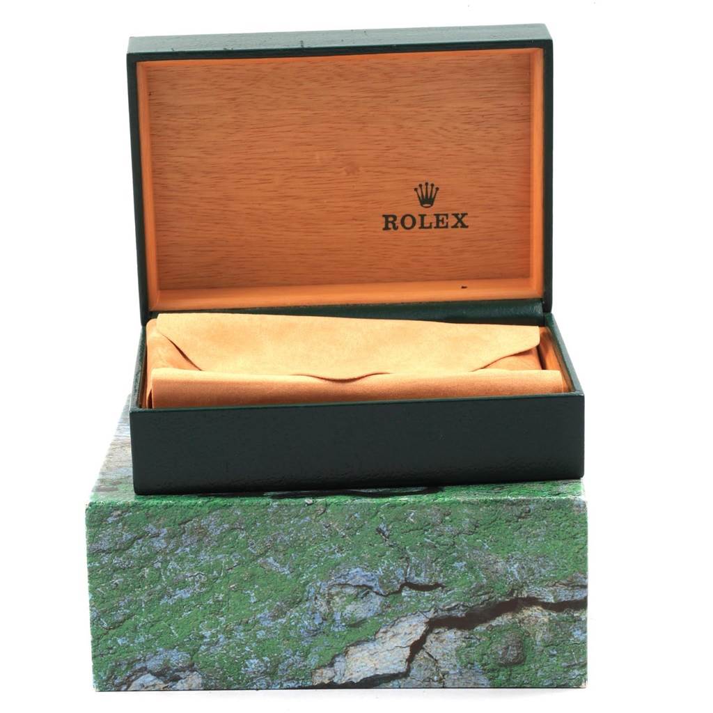 This image shows an open Rolex Date 15223 Men's Steel and Gold (two tone) Champagne Dial 15223 Men's Steel and Gold (two tone) Champagne Dial model watch box with the watch inside a suede pouch.