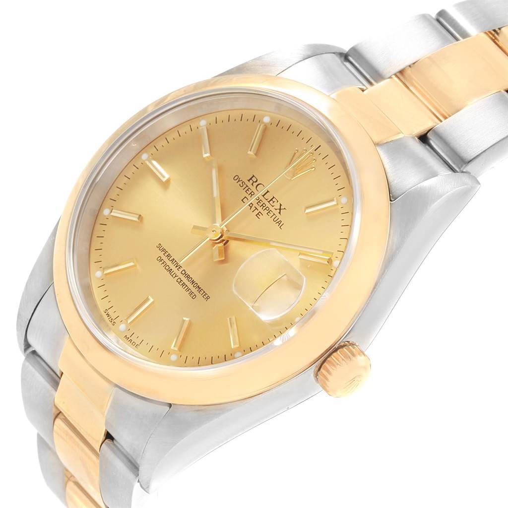 The image shows a close-up angle of a Rolex Date 15203 Men's Steel and Gold (two tone) Champagne Dial 15203 Men's Steel and Gold (two tone) Champagne Dial model watch, highlighting the gold dial, bezel, crown, and two-tone bracelet.