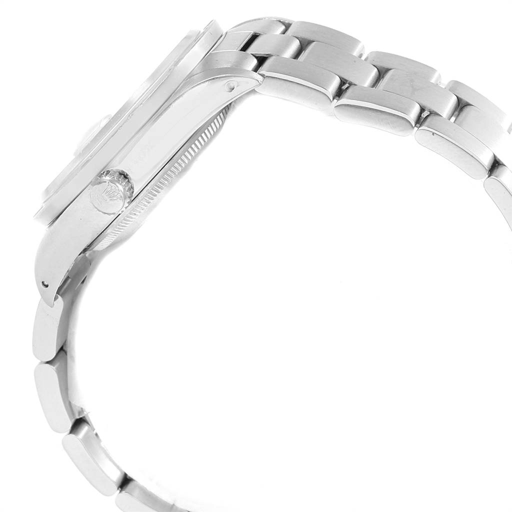 This image shows a side view of a Rolex Date 15210 Men's Stainless Steel White Dial 15210 Men's Stainless Steel White Dial model, focusing on the case and part of the bracelet.