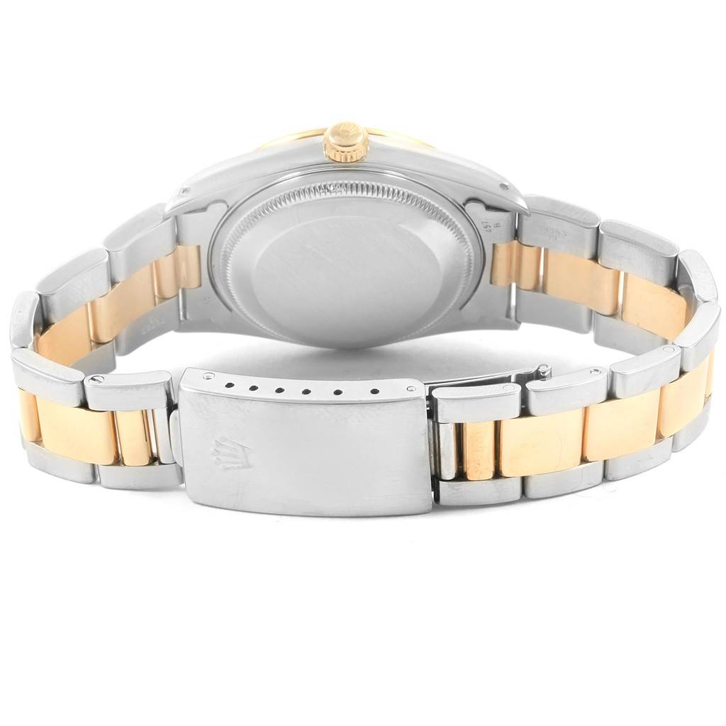 The image shows the back of a Rolex Date 15223 Men's Steel and Gold (two tone) White Dial 15223 Men's Steel and Gold (two tone) White Dial model watch, focusing on the closed clasp and bicolor bracelet.