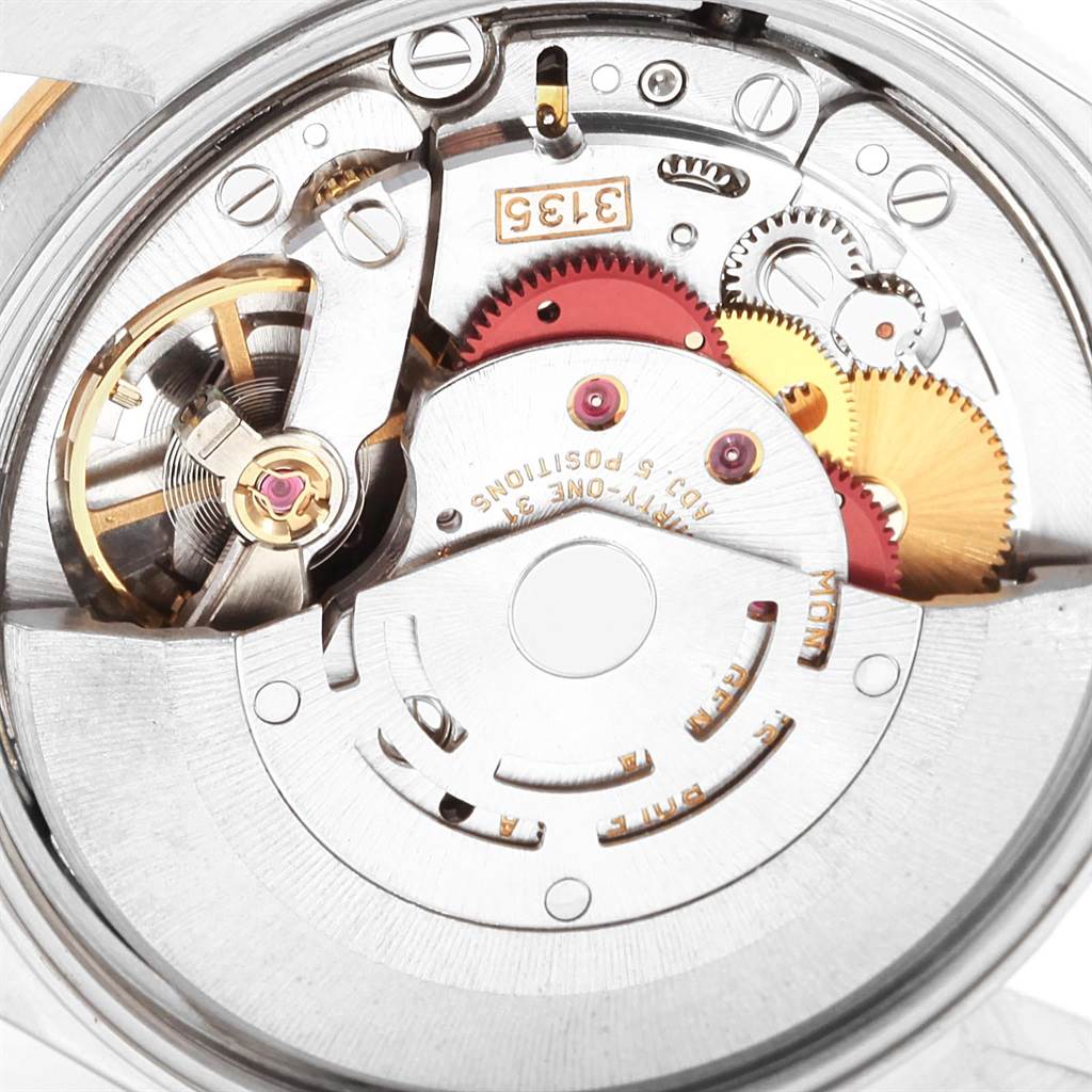 This image shows an up-close view of the movement mechanism of a Rolex Date 15223 Men's Steel and Gold (two tone) White Dial 15223 Men's Steel and Gold (two tone) White Dial model watch.