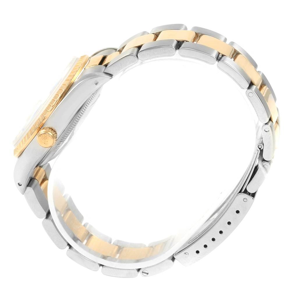 The image shows a Rolex Date 15223 Men's Steel and Gold (two tone) White Dial 15223 Men's Steel and Gold (two tone) White Dial model watch from a side angle, featuring the crown, case, and two-tone bracelet.