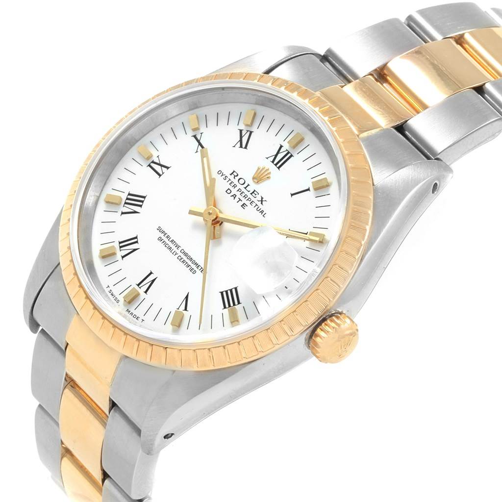 This image shows a Rolex Date 15223 Men's Steel and Gold (two tone) White Dial 15223 Men's Steel and Gold (two tone) White Dial watch angled from the top right, highlighting its dial, bezel, crown, and a portion of the bracelet.