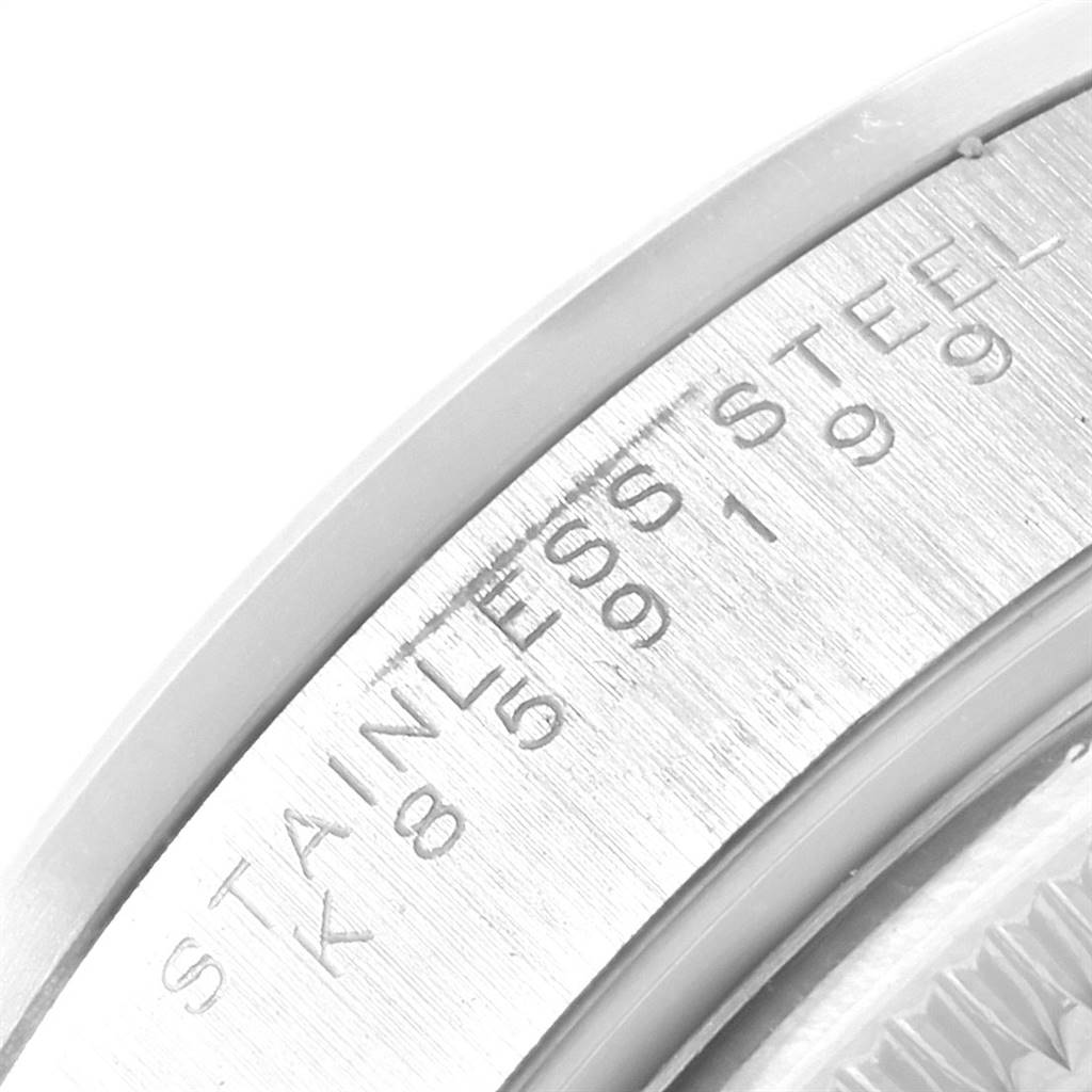 The image shows a close-up view of the case back of a Rolex Date 15200 Men's Stainless Steel White Dial 15200 Men's Stainless Steel White Dial model, highlighting the "STAINLESS STEEL" inscription.