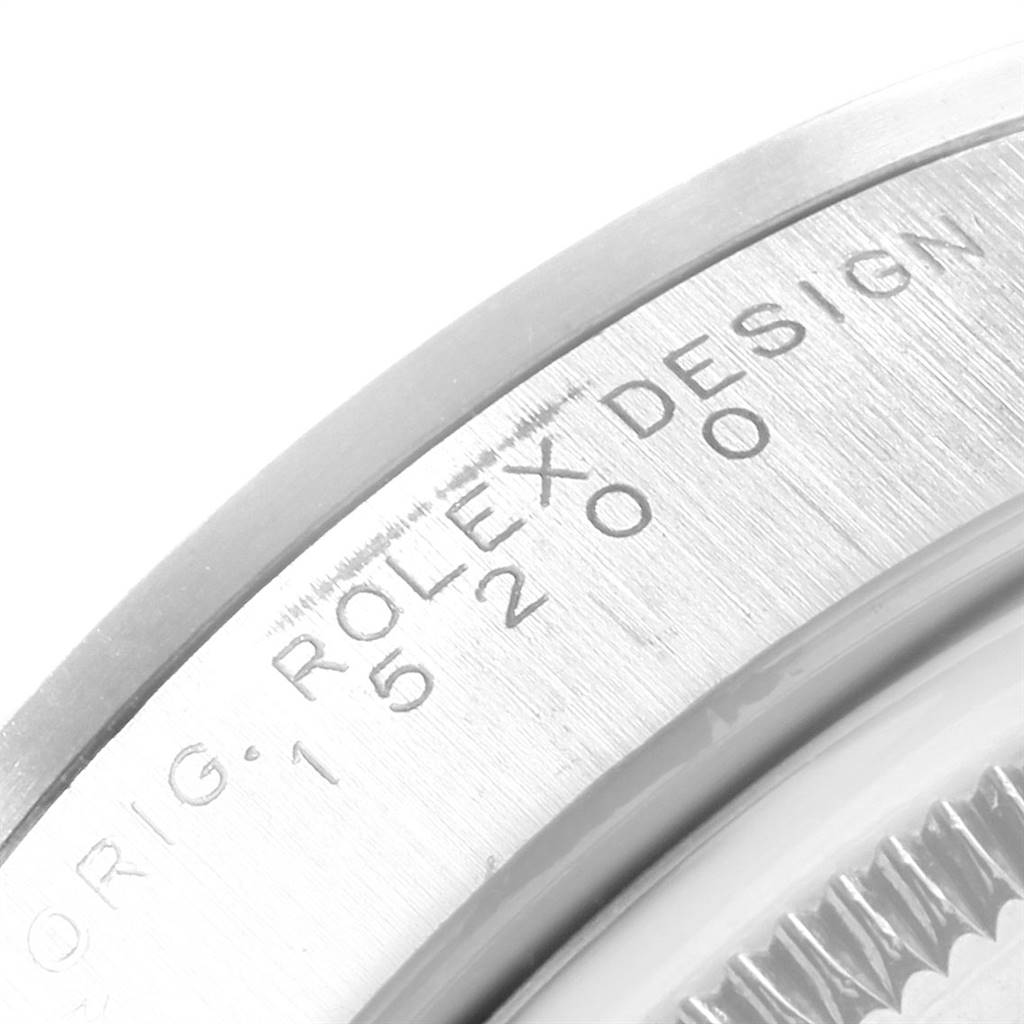 The image shows a close-up of the engraved caseback with "ROLEX DESIGN" and "15200" on a Rolex Date 15200 Men's Stainless Steel White Dial 15200 Men's Stainless Steel White Dial model watch.