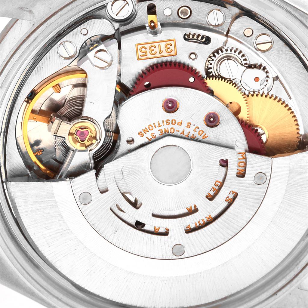The image shows the intricate internal mechanism of a Rolex Date 15200 Men's Stainless Steel White Dial 15200 Men's Stainless Steel White Dial model watch, including gears and the rotor.