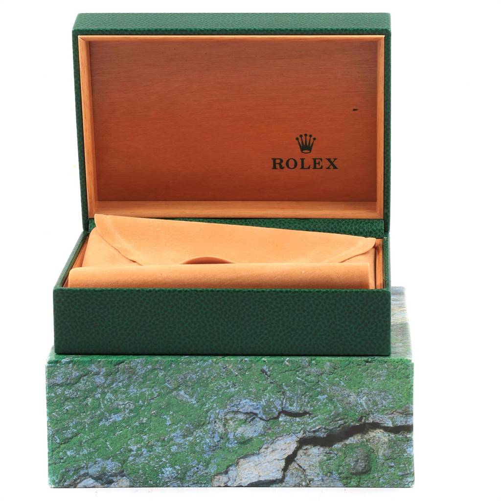 The image shows an open Rolex watch box for the Date model, highlighting the packaging and interior design.