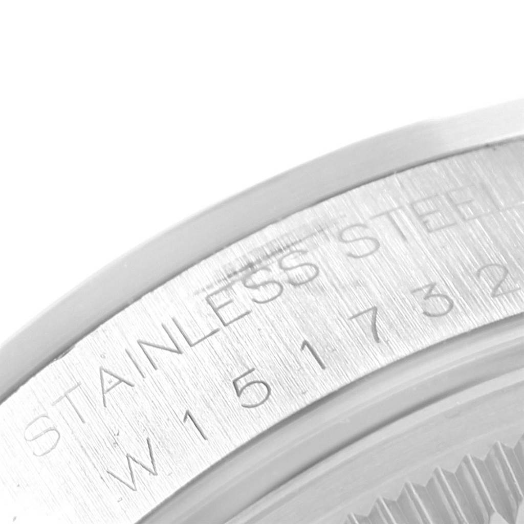 This image shows a close-up of the engraved case back and bezel of a Rolex Date 15200 Men's Stainless Steel Blue Dial 15200 Men's Stainless Steel Blue Dial model, highlighting the stainless steel marking and serial number.
