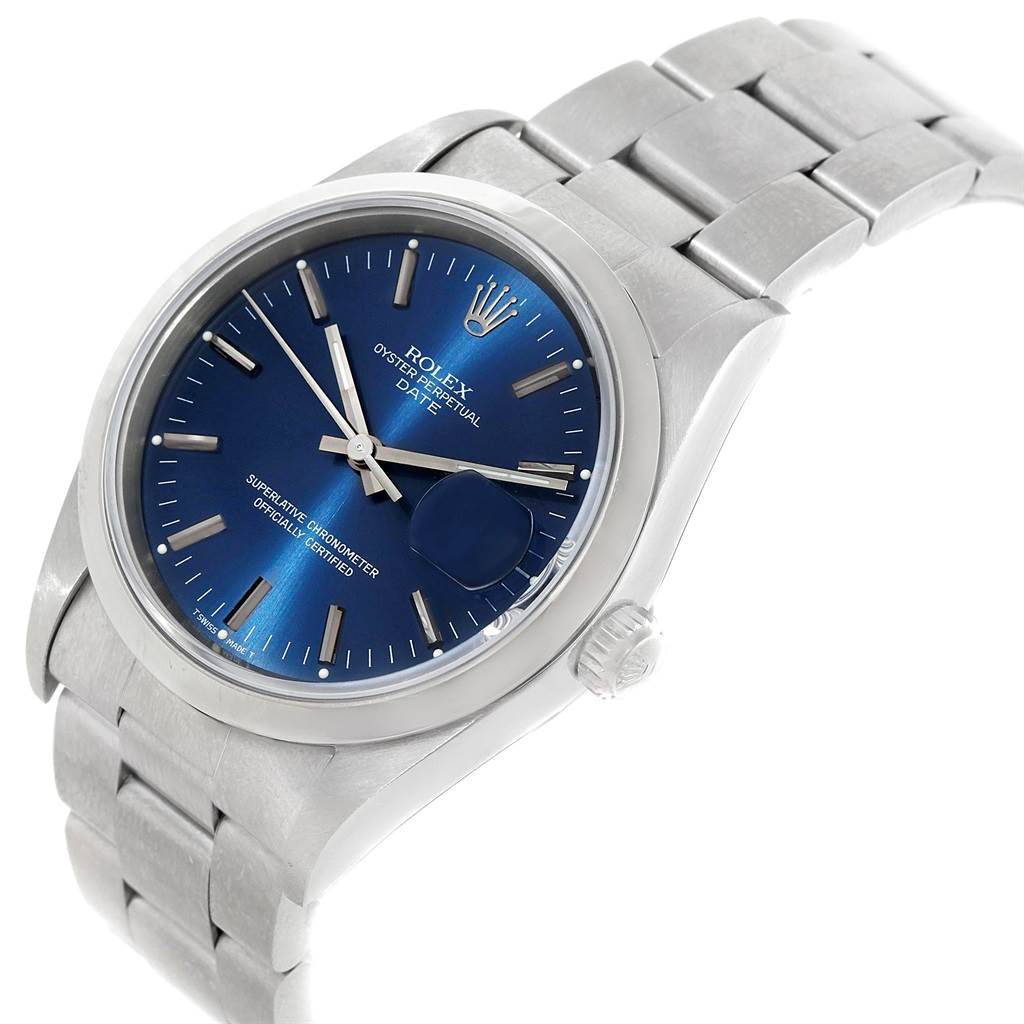 The image shows a Rolex Date 15200 Men's Stainless Steel Blue Dial 15200 Men's Stainless Steel Blue Dial model watch from a slight side angle, highlighting the metal bracelet, blue dial, and crown.