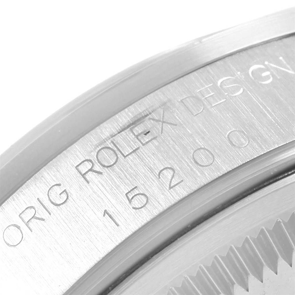 This image shows a close-up of the model and serial number engraving on a Rolex Date 15200 Men's Stainless Steel Blue Dial 15200 Men's Stainless Steel Blue Dial watch.