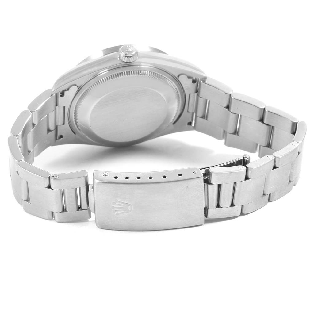 This image shows the back case, crown, and bracelet clasp of a Rolex Date 15210 Men's Stainless Steel Blue Dial 15210 Men's Stainless Steel Blue Dial model watch from a rear angle.