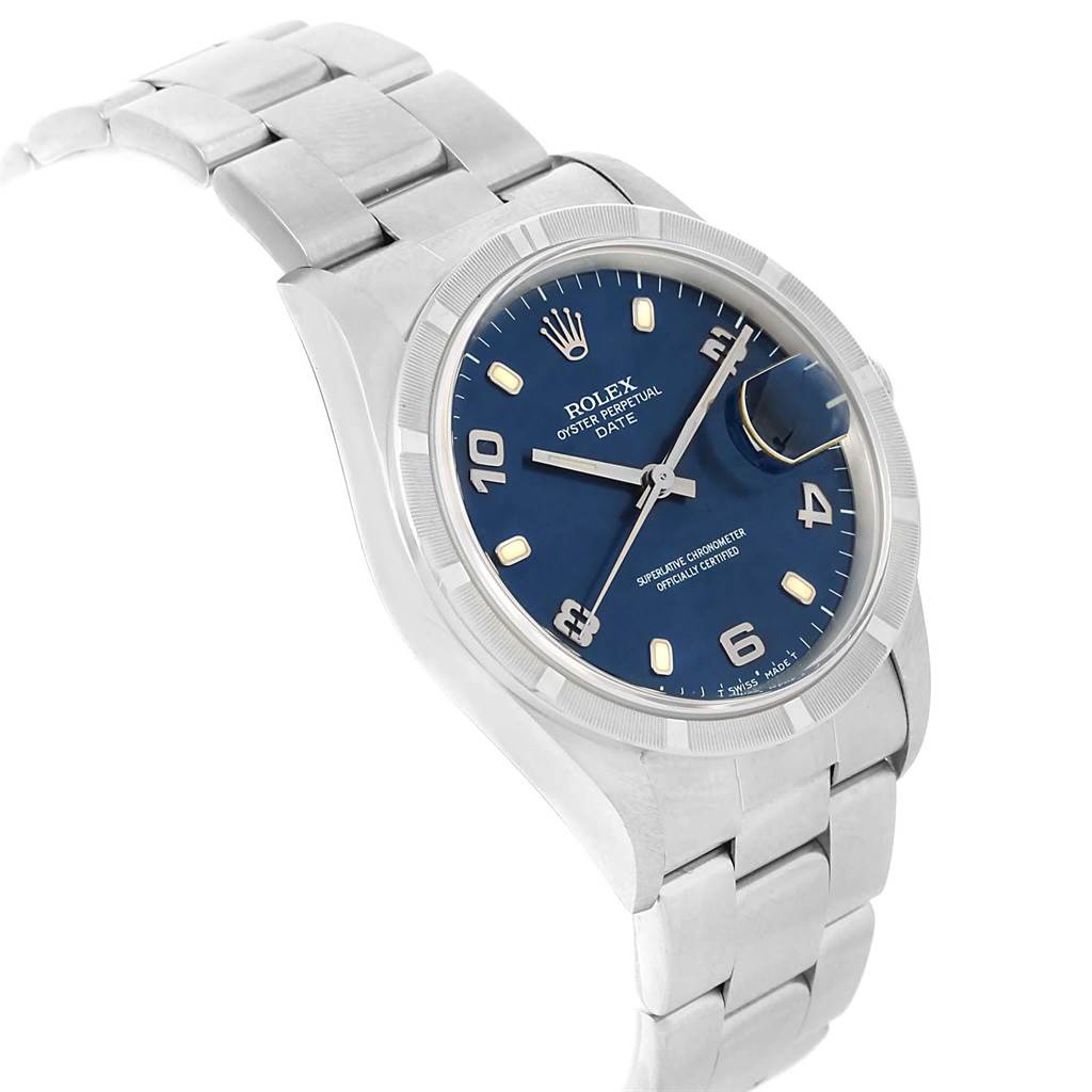 The image shows a Rolex Date 15210 Men's Stainless Steel Blue Dial 15210 Men's Stainless Steel Blue Dial model watch at a slightly tilted angle, highlighting the blue dial, date magnifier, and stainless steel bracelet.