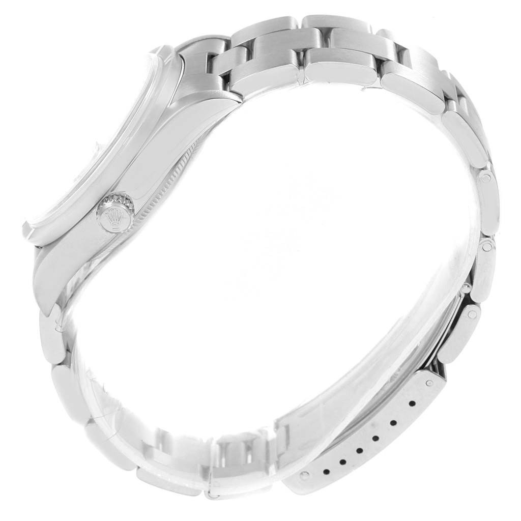 The image shows a side view of a Rolex Date 15210 Men's Stainless Steel Blue Dial 15210 Men's Stainless Steel Blue Dial model, highlighting the case, crown, and bracelet.