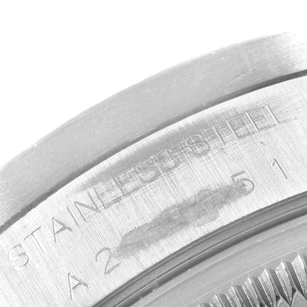 This close-up image shows the stainless steel back case with engravings on a Rolex Date 15210 Men's Stainless Steel Blue Dial 15210 Men's Stainless Steel Blue Dial model watch.