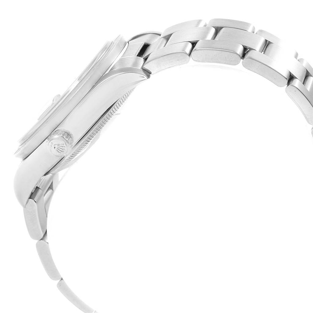 The image shows a side view of a Rolex Date 15210 Men's Stainless Steel Black Dial 15210 Men's Stainless Steel Black Dial model watch, highlighting the crown and part of the bracelet.