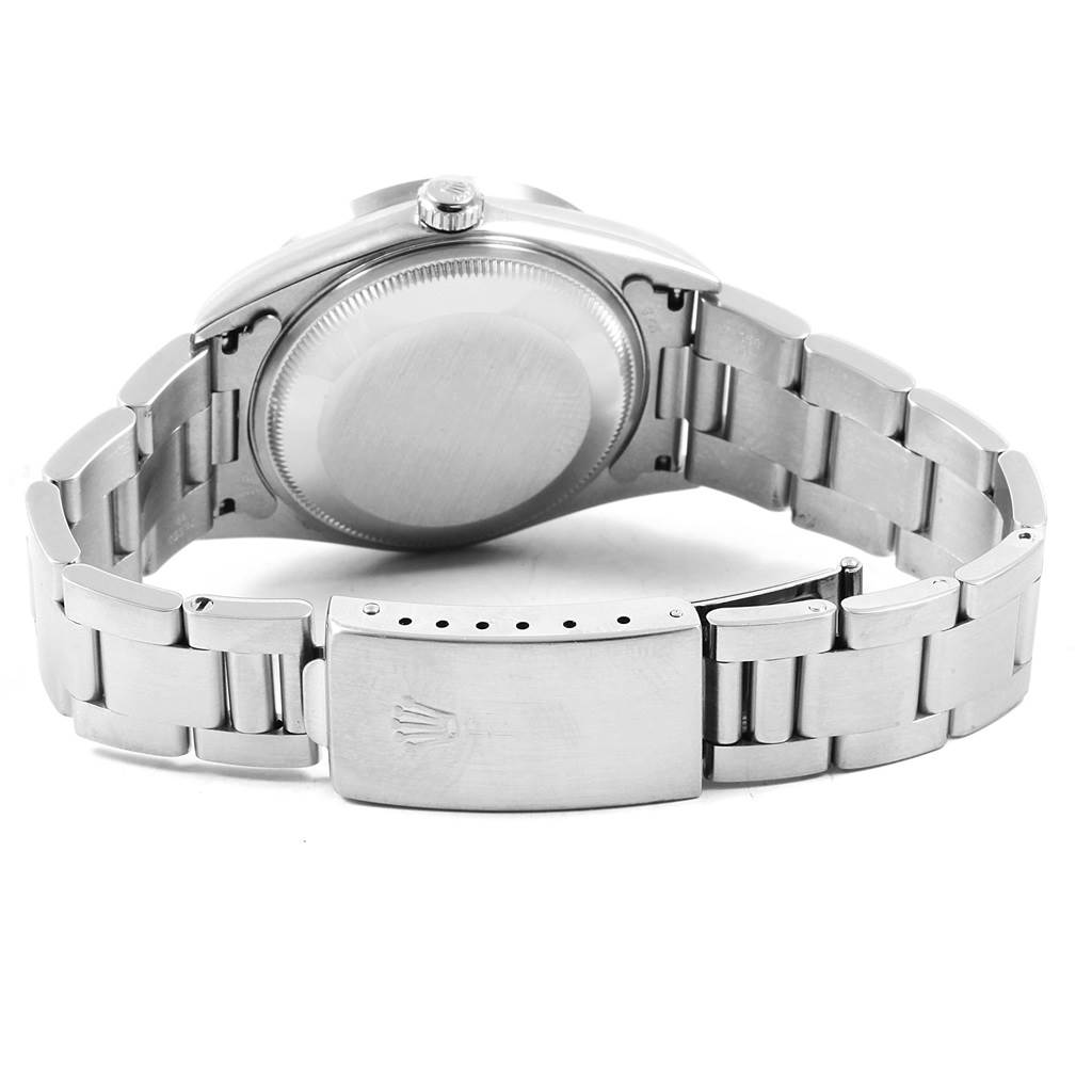 The Rolex Date 15210 Men's Stainless Steel Black Dial 15210 Men's Stainless Steel Black Dial model watch is shown from the back, displaying the case back, bracelet, and clasp with the Rolex logo.