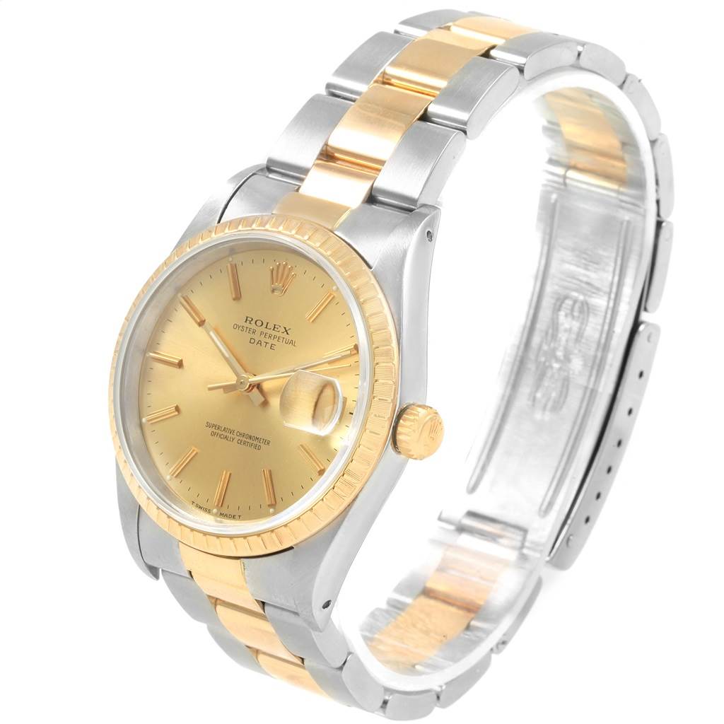 The image displays a Rolex Date 15223 Men's Steel and Gold (two tone) Champagne Dial 15223 Men's Steel and Gold (two tone) Champagne Dial model watch at an angled view, showcasing its dial, bezel, and two-tone bracelet.
