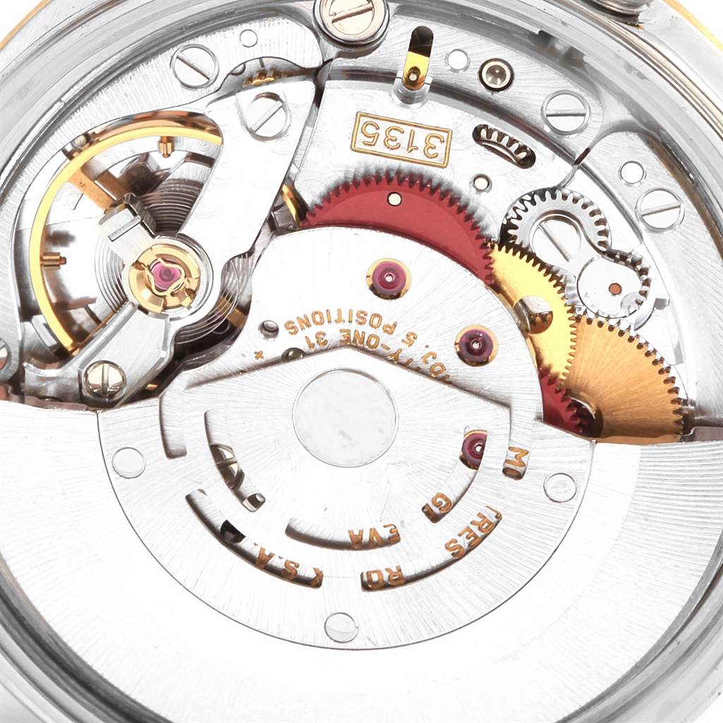 This image shows a close-up view of the mechanical movement parts inside a Rolex Date 15223 Men's Steel and Gold (two tone) Champagne Dial 15223 Men's Steel and Gold (two tone) Champagne Dial model watch.