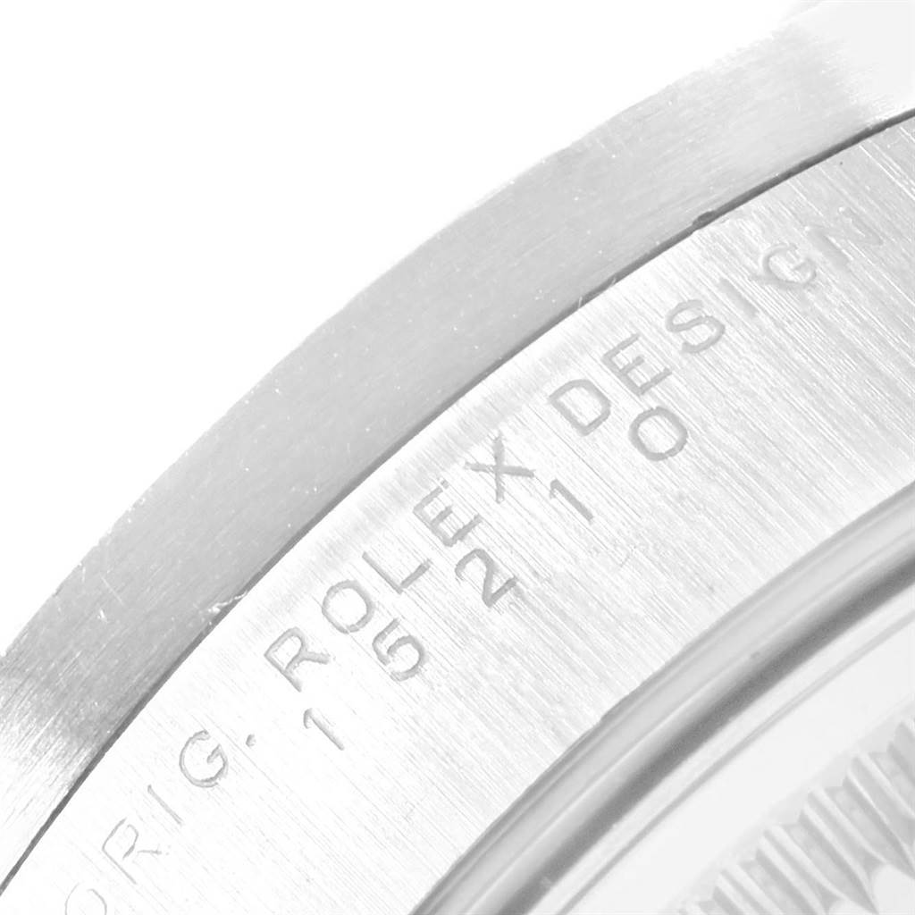 The image shows a close-up of the case band with engraving on the Rolex Date 15210 Men's Stainless Steel Silver Dial 15210 Men's Stainless Steel Silver Dial model.