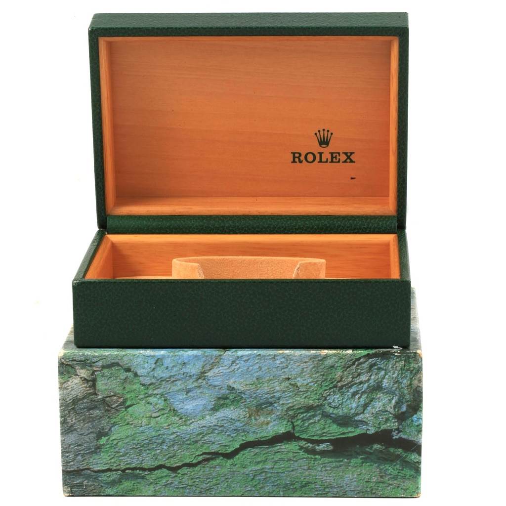 The image shows an open green and wooden box for a Rolex Date 15210 Men's Stainless Steel Silver Dial 15210 Men's Stainless Steel Silver Dial model watch from a front angle.