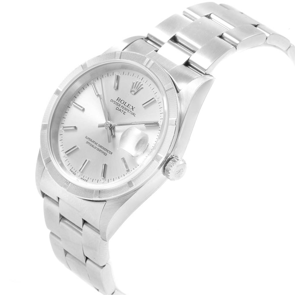 The image shows a Rolex Date 15210 Men's Stainless Steel Silver Dial 15210 Men's Stainless Steel Silver Dial model watch from an angled top view, highlighting the face, bezel, crown, and bracelet.