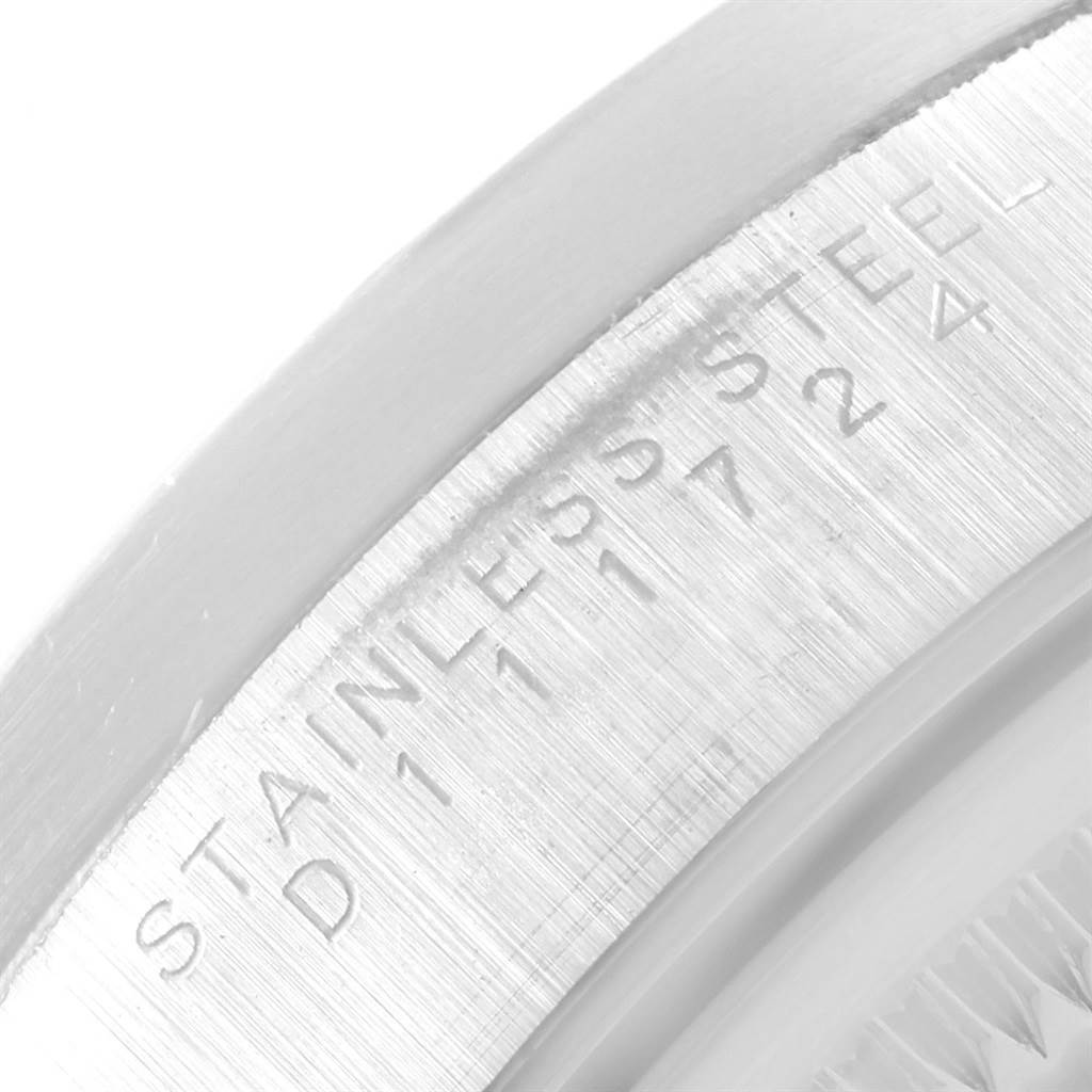 This is a close-up of the inner bezel of a Rolex Date 15210 Men's Stainless Steel Silver Dial 15210 Men's Stainless Steel Silver Dial model, showing the "STAINLESS STEEL" engraving.