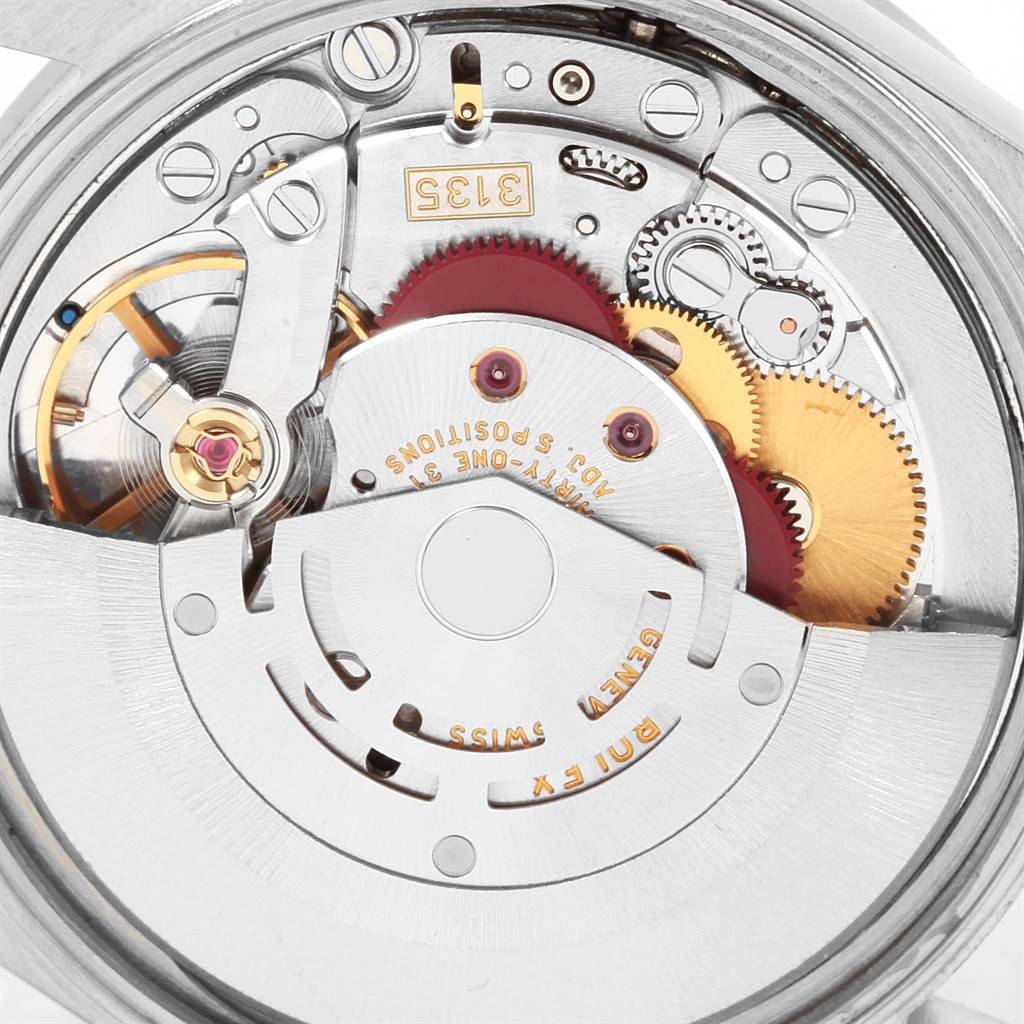 This image shows the intricate mechanical movement and inner components of a Rolex Date 15210 Men's Stainless Steel Silver Dial 15210 Men's Stainless Steel Silver Dial model watch.