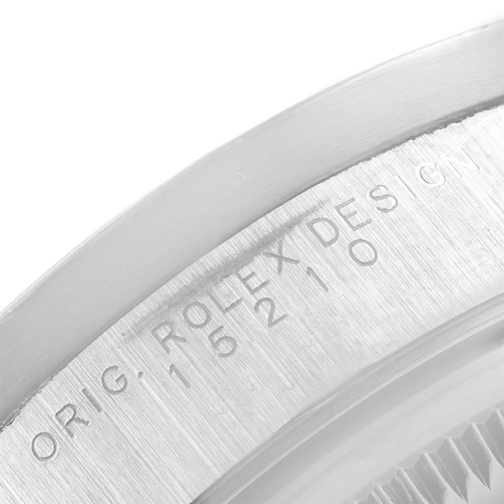 This image shows a close-up of the case side of a Rolex Date 15210 Men's Stainless Steel Silver Dial 15210 Men's Stainless Steel Silver Dial model, focusing on the engraved serial number and "ROLEX DESIGN" text.