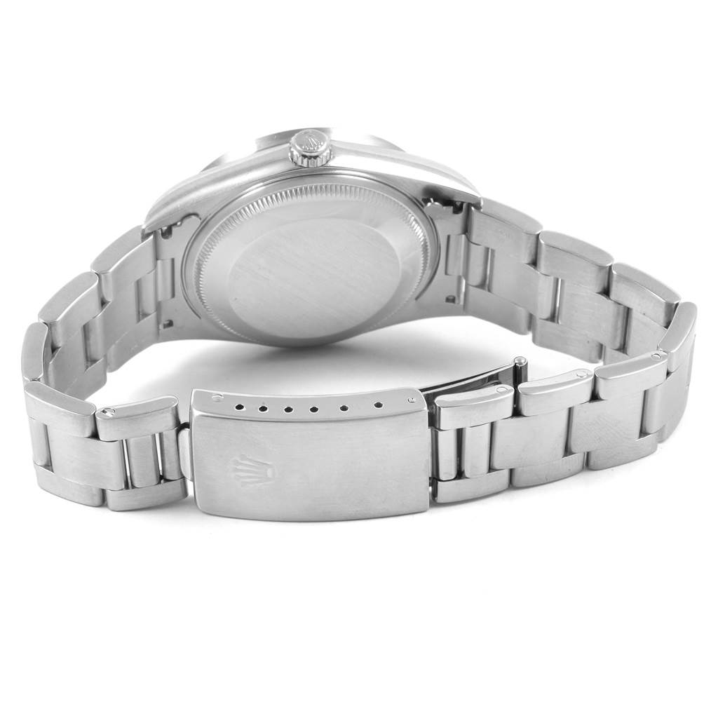 This image shows the back case and the bracelet clasp of a Rolex Date 15210 Men's Stainless Steel Silver Dial 15210 Men's Stainless Steel Silver Dial model watch.