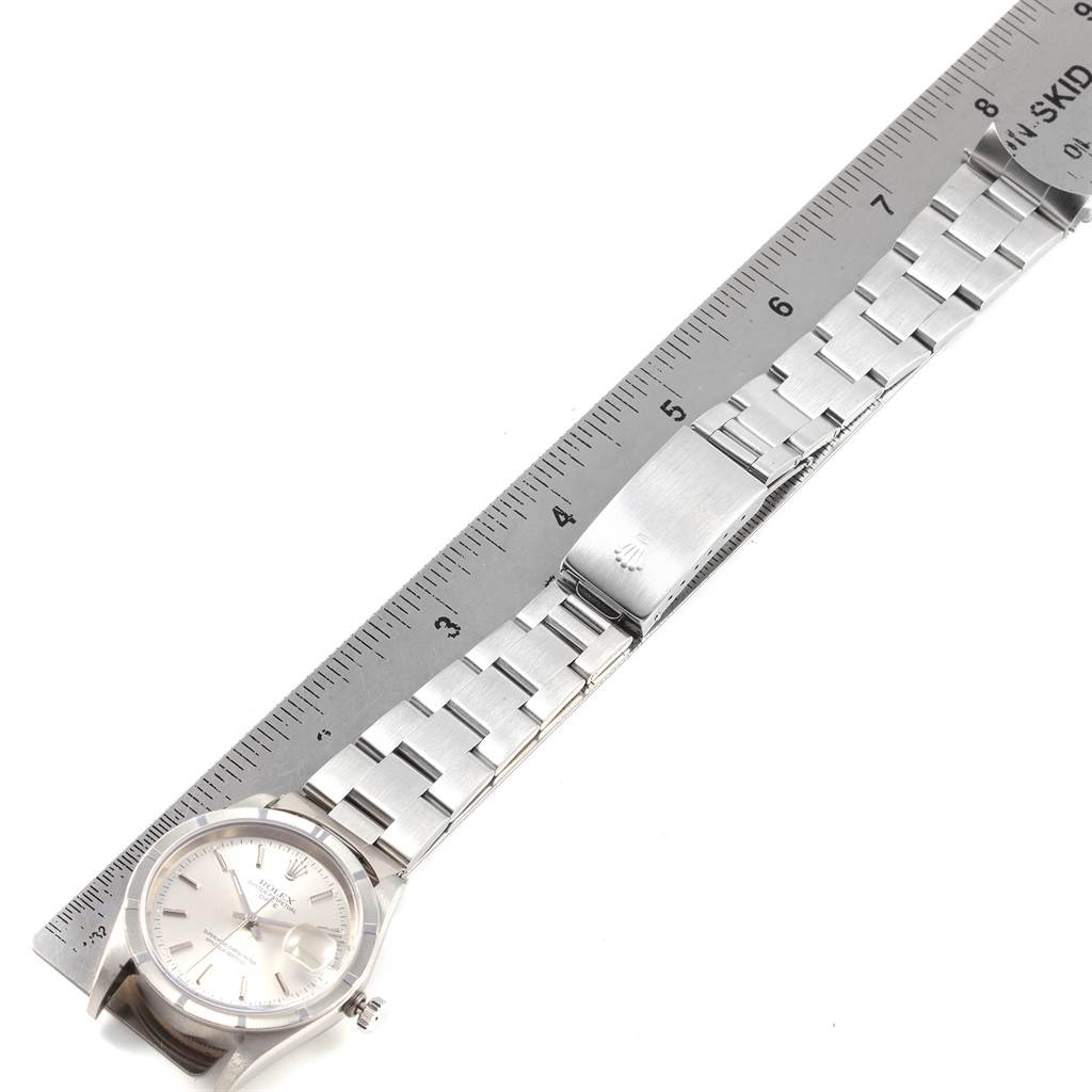 The image shows a Rolex Date 15210 Men's Stainless Steel Silver Dial 15210 Men's Stainless Steel Silver Dial model watch, showcasing the full face and bracelet band, measured against a ruler.