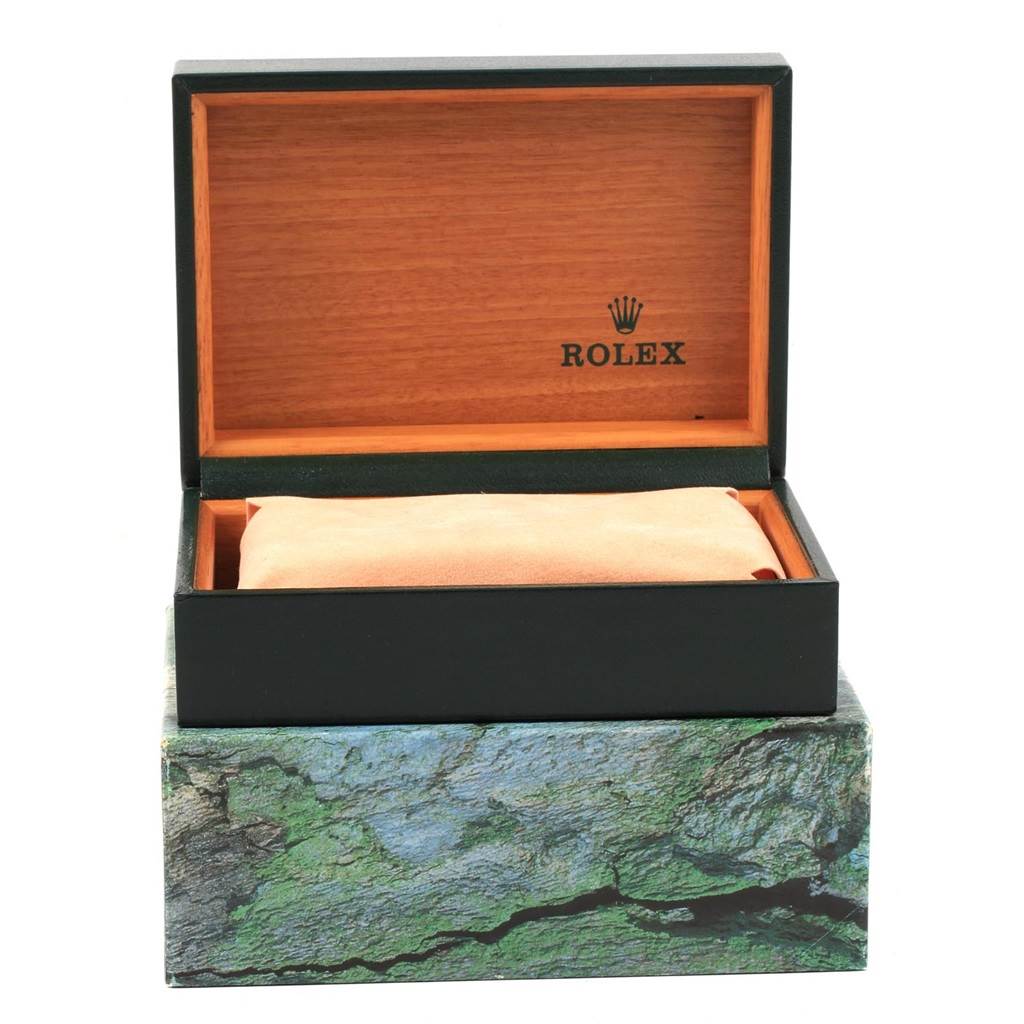 The image shows an open Rolex watch box for the Date model, displaying the interior cushion and brand logo inside.