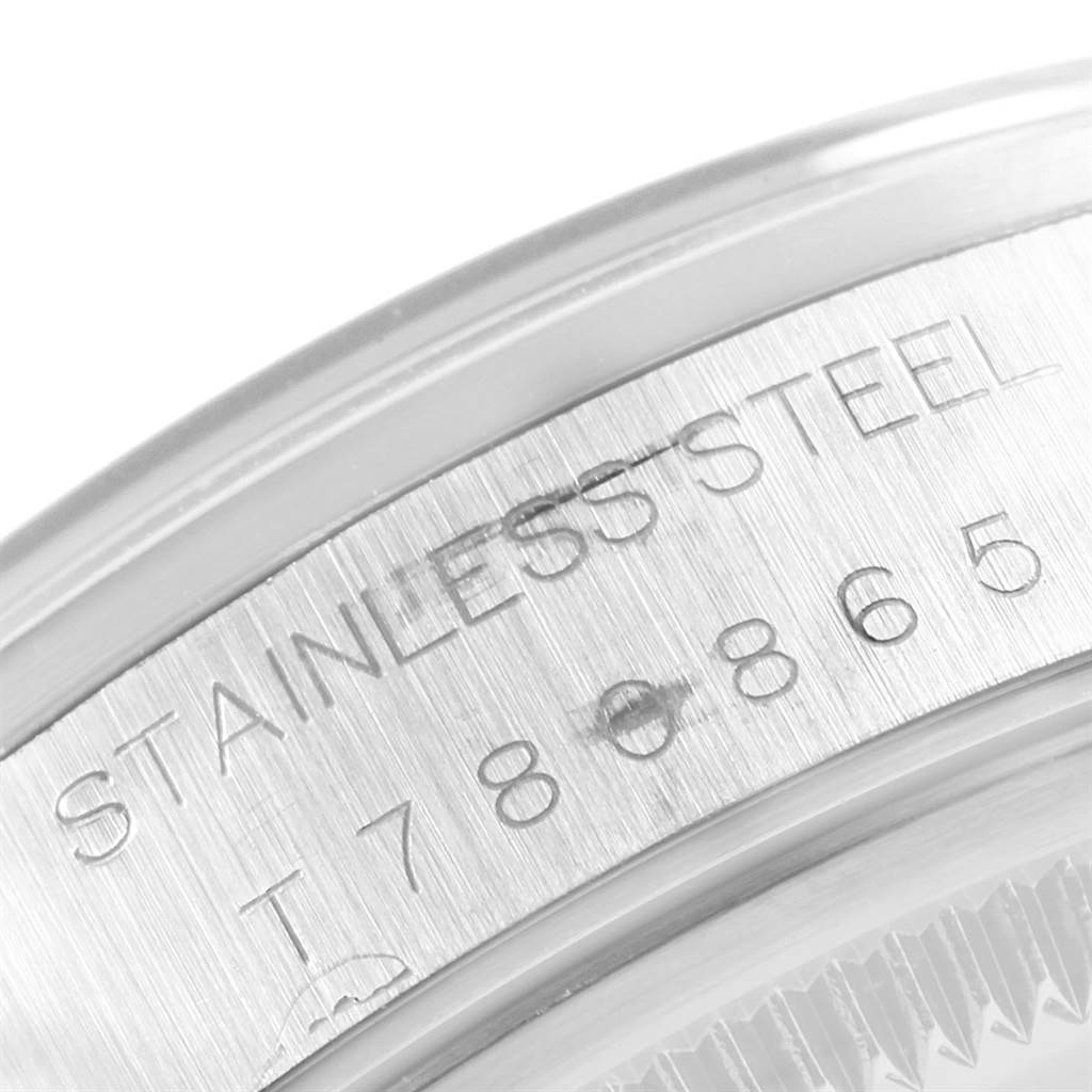 The image shows a close-up of the stainless steel case back engraving of a Rolex Date 15200 Men's Stainless Steel White Dial 15200 Men's Stainless Steel White Dial model watch.