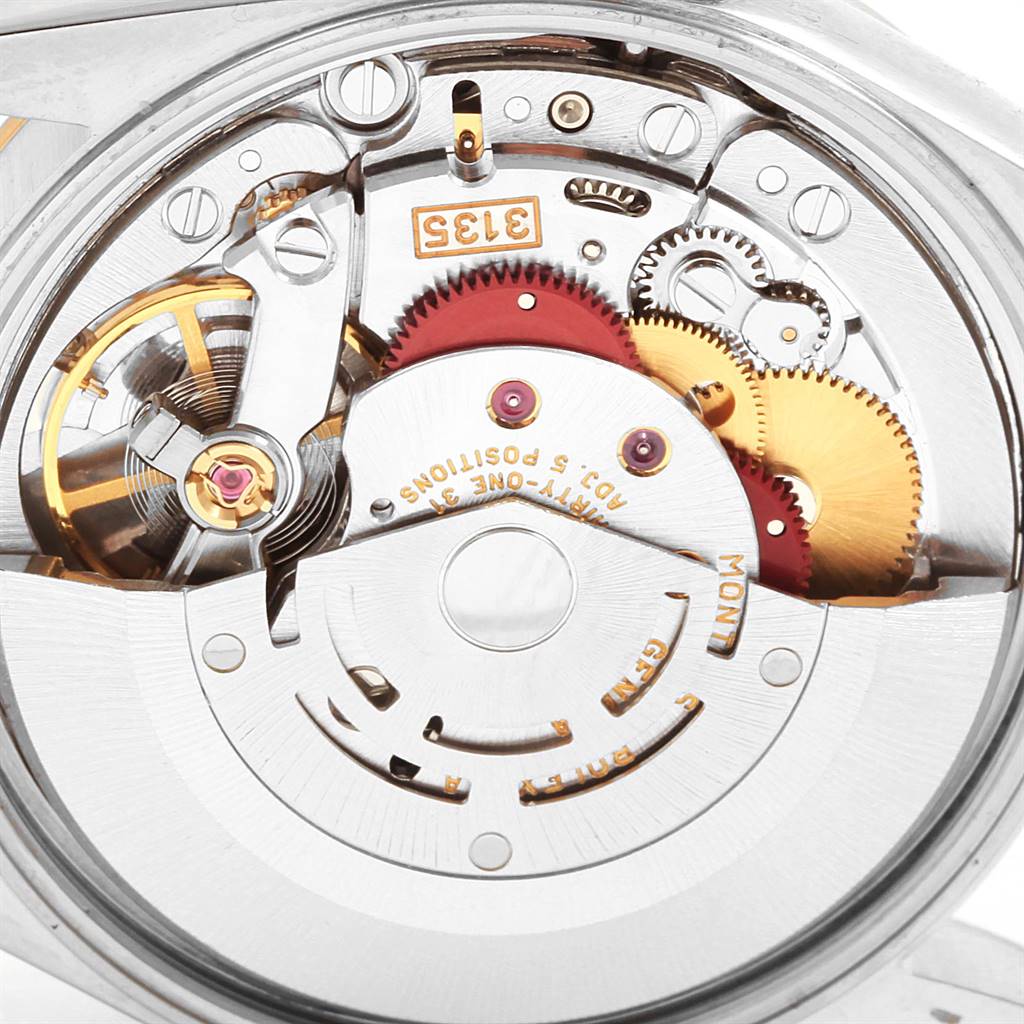 The image shows a close-up of the internal mechanism of a Rolex Date 15203 Men's Steel and Gold (two tone) Grey Dial 15203 Men's Steel and Gold (two tone) Grey Dial model watch, revealing its intricate gears and components.
