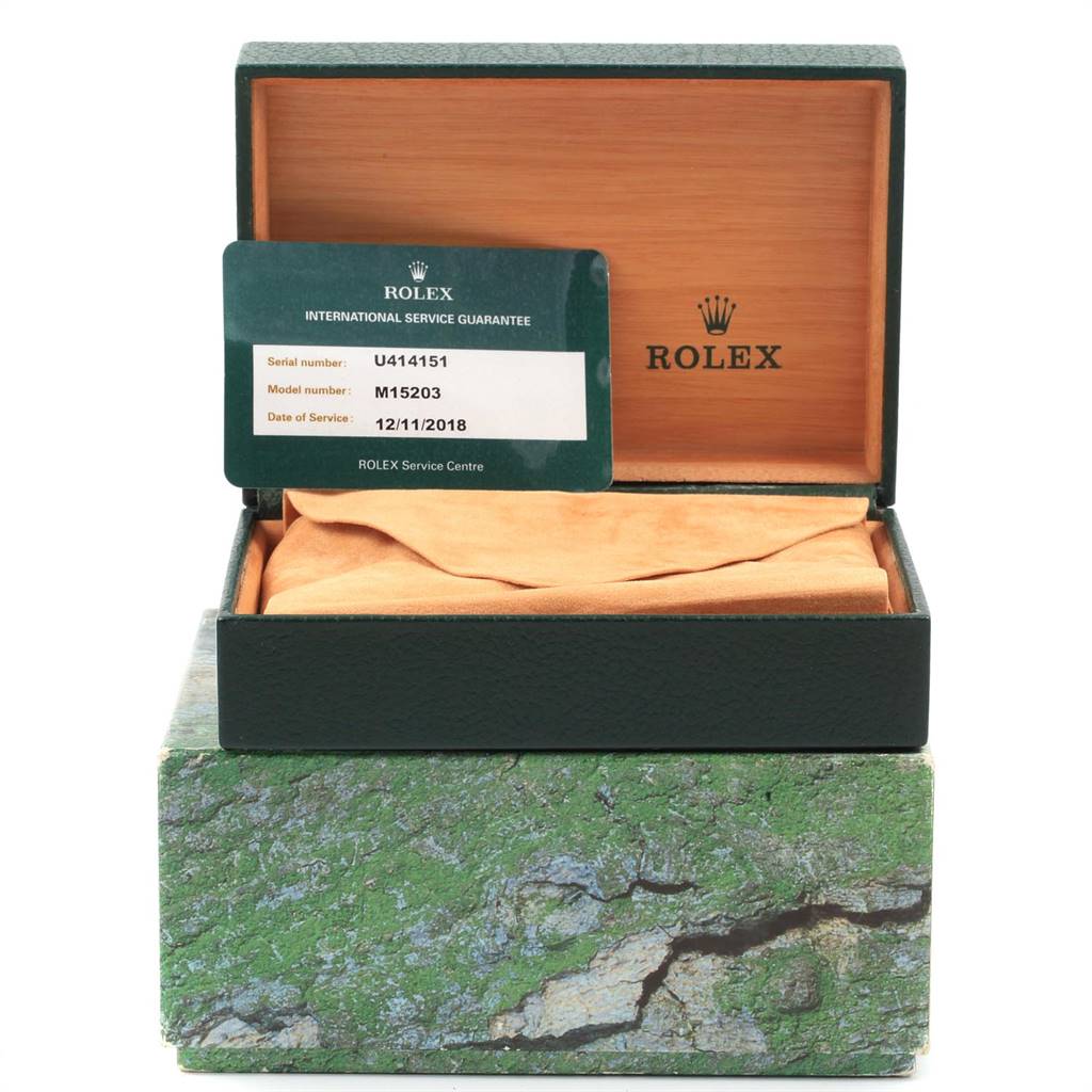 The image shows an open Rolex Date 15203 Men's Steel and Gold (two tone) Grey Dial 15203 Men's Steel and Gold (two tone) Grey Dial model box with a warranty card inside.