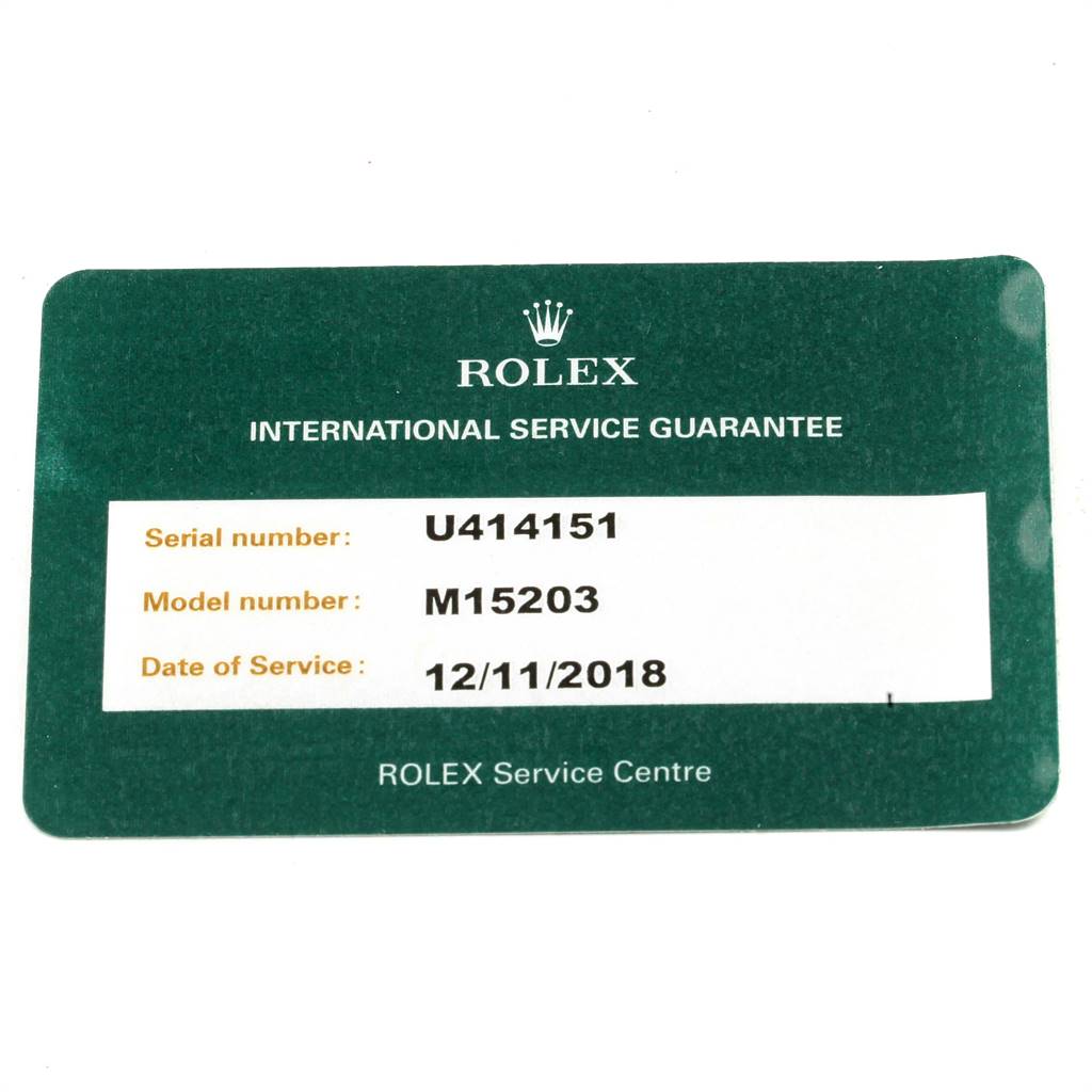 The image shows an international service guarantee card for a Rolex Date 15203 Men's Steel and Gold (two tone) Grey Dial 15203 Men's Steel and Gold (two tone) Grey Dial model, providing serial number, model number, and date of service.